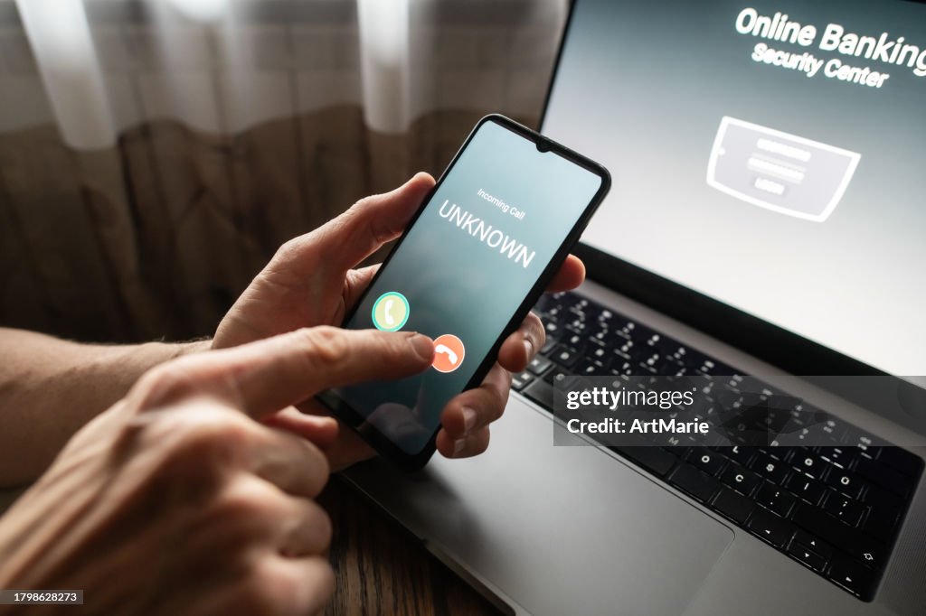 Senior man refuses to answer to a call from unknown number. Scam and fraud prevention with smartphone concept.