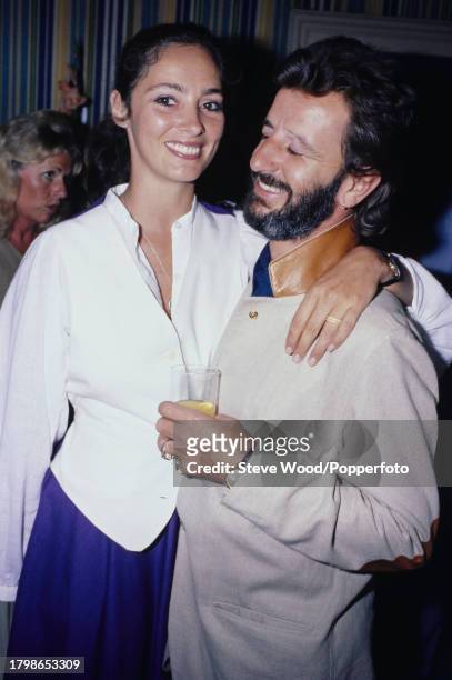 Former Beatles drummer Ringo Starr with his American partner and model Nancy Lee Andrews at a party, circa 1978.