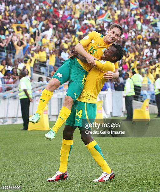 Dean Furman of South Africa celebrates his goal with Bongani Khumalo of South Africa during the 2014 FIFA World Cup Qualifier match between South...