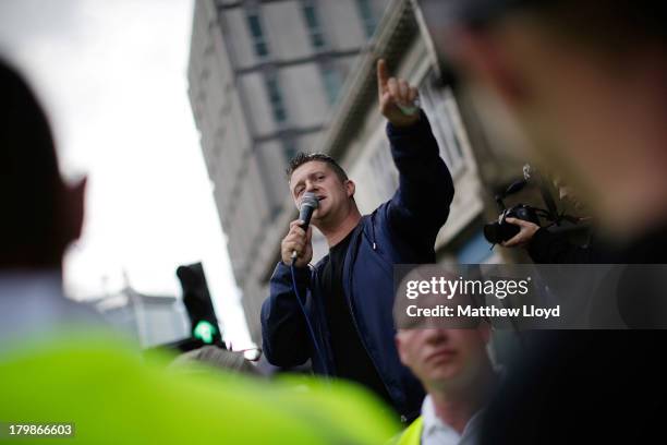 Leader Stephen Lennon aka Tommy Robinson makes a speech to members of the English Defence League at Aldgate on September 7, 2013 in London, England....