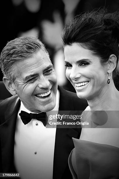 Actors George Clooney and Sandra Bullock attend the Opening Ceremony And 'Gravity' Premiere at Palazzo del Cinema on August 28, 2013 in Venice, Italy.