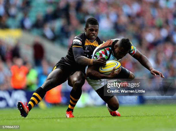 Christian Wade of London Wasps tackled Ugo Monye of Harlequins during the Aviva Premiership match between London Wasps and Harlequins at Twickenham...