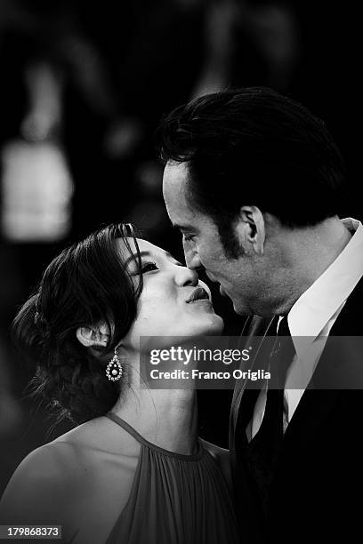 Actor Nicolas Cage kisses his wife Alice Kim Cage at the 'Joe' Premiere during The 70th Venice International Film Festival at Palazzo Del Cinema on...