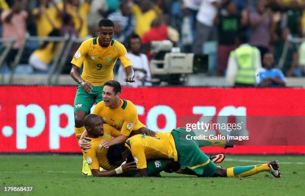 Dean Furman of South Africa and Bernard Parker of South Africa celebrate after scoring a goal during the 2014 FIFA World Cup Qualifier match between...