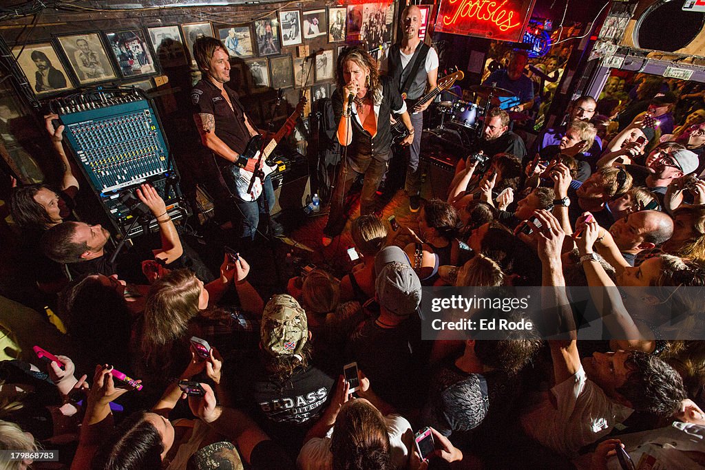 Keith Urban Promotes His New Album "Fuse" With Surprise Performances In Nashville