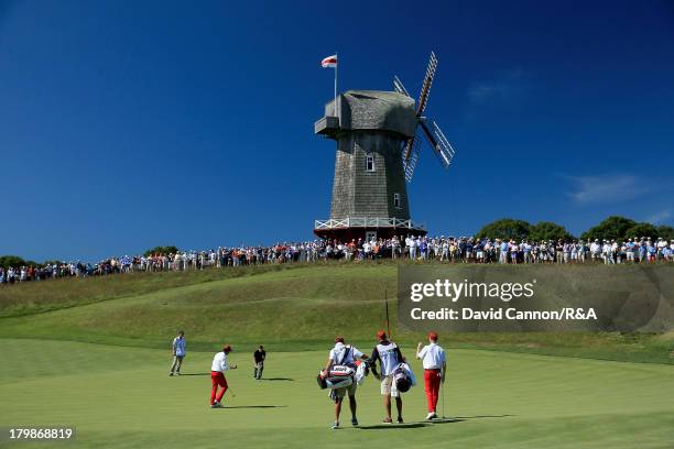 Nathan Smith of the USA holes a bridie putt to win the 16th hole in his match with Jordan Niebrugge against Matthew Fitzpatrick and Neil Raymond of...