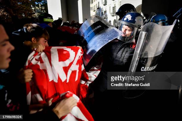 Riot police clash with students during the student protest demonstration against the Italian Government on November 17, 2023 in Turin, Italy....