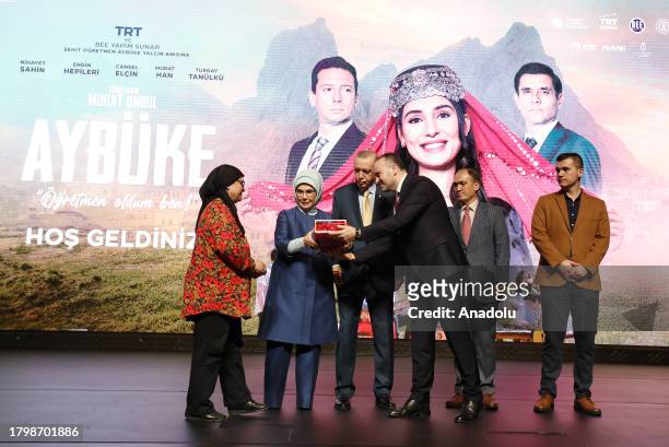 Mehmet Zahid Sobaci, the director general of Turkish public broadcaster TRT, presents a gift to the mother of Senay Aybuke Yalcin as Turkish...