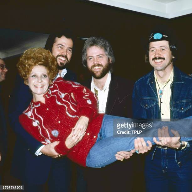View of, standing from left, American Pop musicians members Merrill Osmond, Alan Osmond, and Wayne Osmond, all of the group the Osmond Brothers, as...