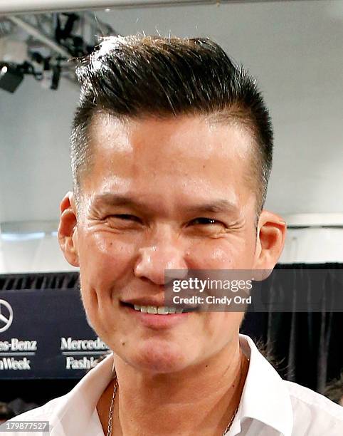 Stylist Jorge Luis prepares backstage at the Son Jung Wan fashion show during Mercedes-Benz Fashion Week Spring 2014 at The Studio at Lincoln Center...