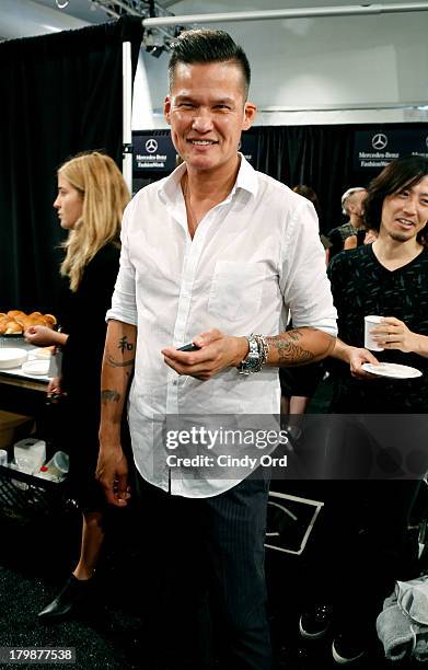 Stylist Jorge Luis prepares backstage at the Son Jung Wan fashion show during Mercedes-Benz Fashion Week Spring 2014 at The Studio at Lincoln Center...