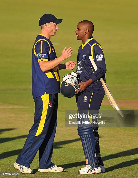 Simon Jones of Glamorgan wishes Dimitri Mascarenhas of Hampshire all the best after his final appearance at the Ageas Bowl during the Yorkshire Bank...