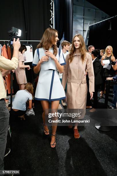 Models prepare backstage at the Lacoste show during Spring 2014 Mercedes-Benz Fashion Week at The Theatre at Lincoln Center on September 7, 2013 in...