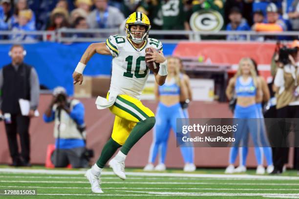 Green Bay Packers quarterback Jordan Love runs the ball during an NFL Thanksgiving Day football game between the Detroit Lions and the Green Bay...
