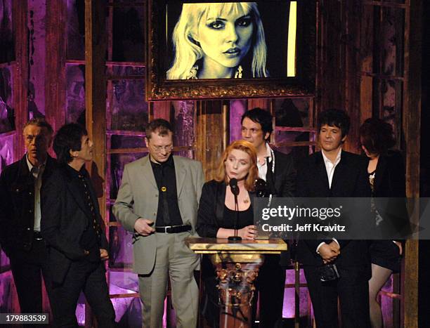 Nigel Harrison, Frank Infante, Gary Valentine, Debbie Harry, Jimmy Destri and Clem Burke of Blondie, inductees, with presenter Shirley Manson