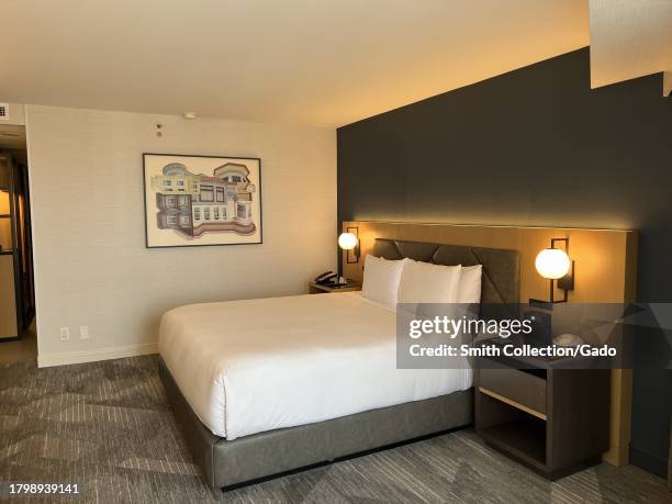 Modern hotel room interior with king-sized bed and artwork at the Hyatt Regency, San Francisco, California, August 17, 2023.