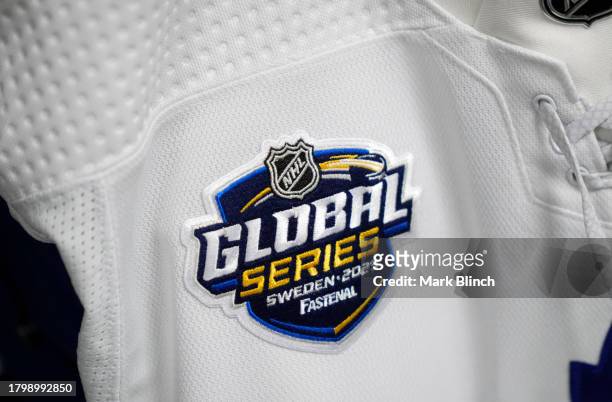 Detailed view is seen of the 2023 NHL Global Series patch on a Toronto Maple Leafs jersey in the locker room before the start of the 2023 NHL Global...