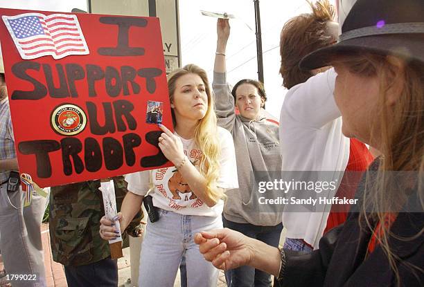 Pro-war activist Jennifer Shelton , whose husband, Marine Staff Sgt.Jon Shelton, is in Kuwait, engages in a heated argument with peace-activist Marie...