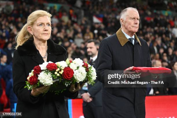Sir Geoff Hurst and Debbie Hewitt lay a wreath on the pitch in remembrance of Sir Bobby Charlton CBE prior to the UEFA EURO 2024 European qualifier...