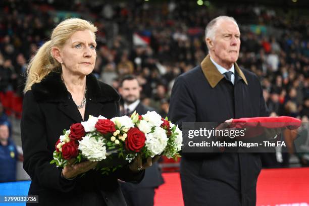 Sir Geoff Hurst and Debbie Hewitt lay a wreath on the pitch in remembrance of Sir Bobby Charlton CBE prior to the UEFA EURO 2024 European qualifier...