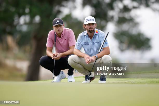 Ludvig Aberg of Sweden and Cameron Young of the United States line up putts on the 16th green during the second round of The RSM Classic on the...