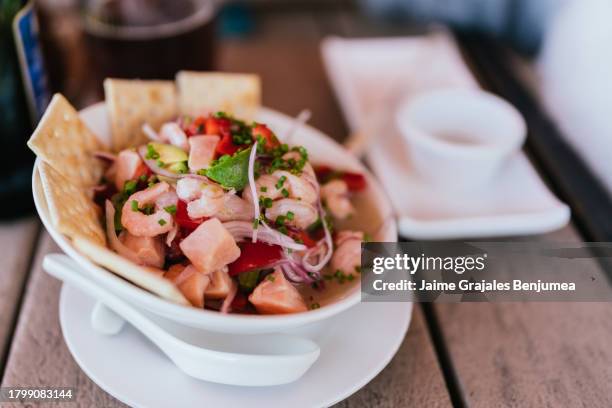 closeup of plate of ceviche on restaurant table - seviche stock pictures, royalty-free photos & images