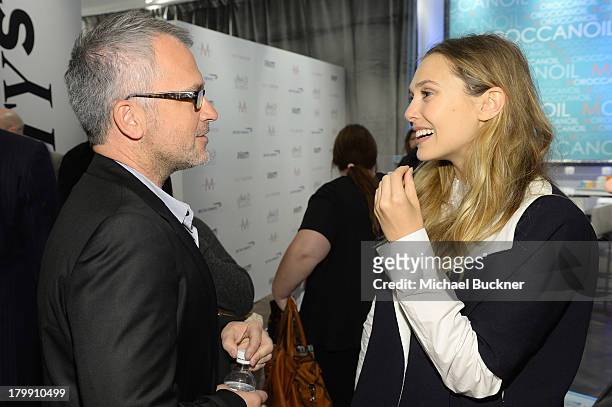 Filmmaker Charlie Stratton and actress Elizabeth Olsen attend the Variety Studio presented by Moroccanoil at Holt Renfrew during the 2013 Toronto...