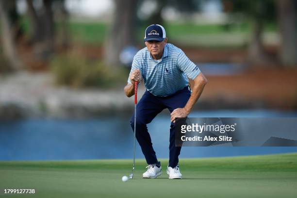 Davis Love III of the United States lines up a putt on the 18th green during the second round of The RSM Classic on the Seaside Course at Sea Island...