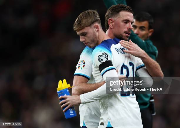 Jordan Henderson and Cole Palmer of England shake hands as Cole Palmer enters the pitch as a substitute during the UEFA EURO 2024 European qualifier...