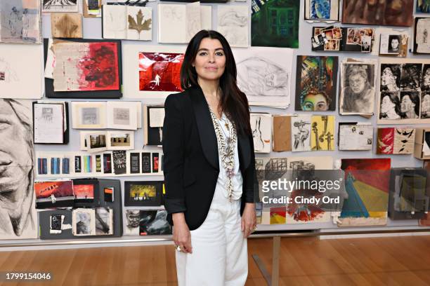 Artist and designer Es Devlin poses for a photo in front of artwork on display at 'An Atlas Of Es Devlin' exhibition press preview at Cooper Hewitt,...