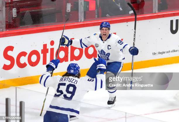 John Tavares of the Toronto Maple Leafs reacts after scoring a goal during the third period of the 2023 NHL Global Series in Sweden between the...
