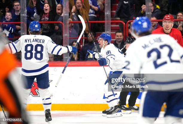 John Tavares of the Toronto Maple Leafs reacts after scoring a goal during the third period of the 2023 NHL Global Series in Sweden between the...