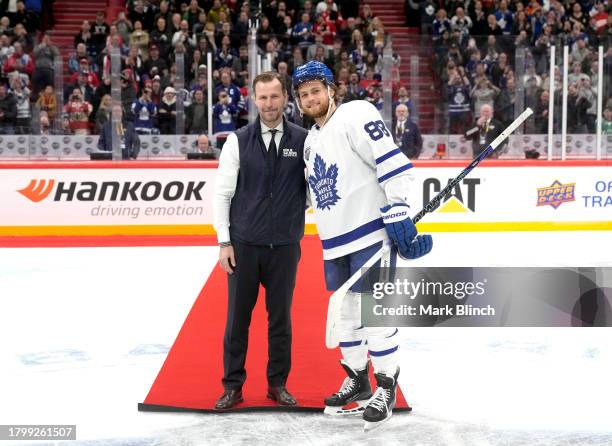 William Nylander of the Toronto Maple Leafs and Anders Salming pose for a photo at center ice after the Toronto Maple Leafs 3-2 win over the Detroit...