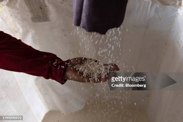 Rice is filled in a sack inside a rice mill in Kalasin province, Thailand, on Monday, Nov. 20, 2023. Limited supply from Vietnam has led to buyers...