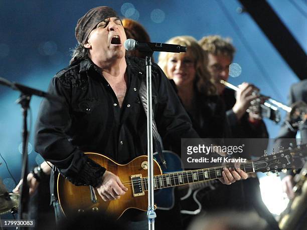 Musician Bruce Springsteen, guitarists Steven Van Zandt and Soozie Tyrell of the E Street Band perform at the Bridgestone halftime show during Super...