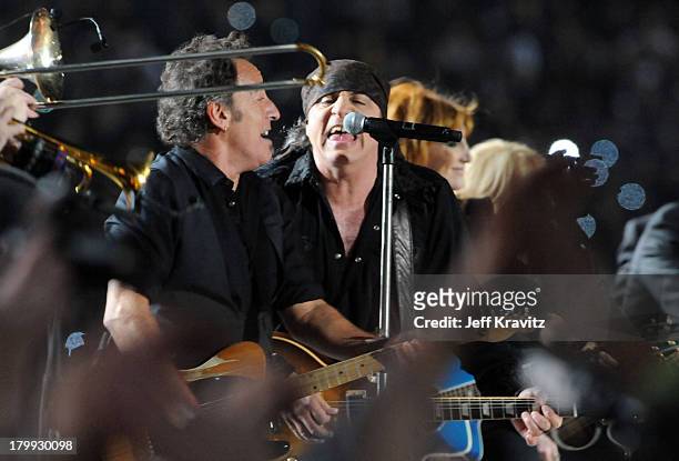 Musician Bruce Springsteen and guitarist Steven Van Zandt of the E Street Band perform at the Bridgestone halftime show during Super Bowl XLIII...