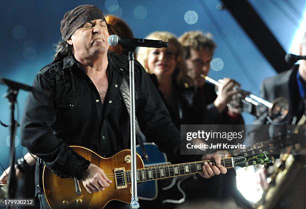 Musician Bruce Springsteen, guitarists Steven Van Zandt and Soozie Tyrell of the E Street Band perform at the Bridgestone halftime show during Super...