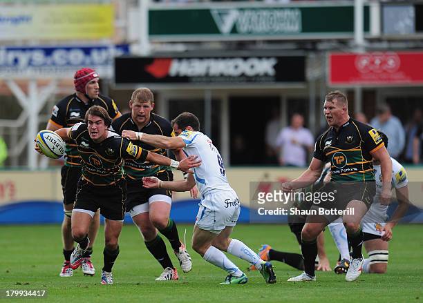 Lee Dickson of Northampton Saints holds off Haydn Thomas of Exeter Chiefs during the Aviva Premiership match between Northampton Saints and Exeter...