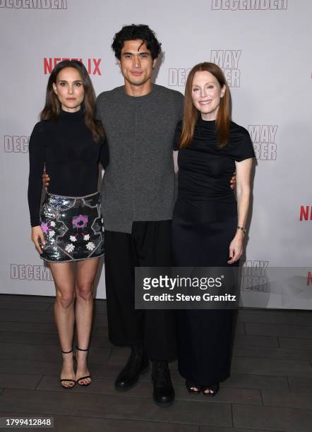 Natalie Portman, Charles Melton and Julianne Moore pose at the Netflix's "May December" Los Angeles Photo Call at Four Seasons Hotel Los Angeles at...