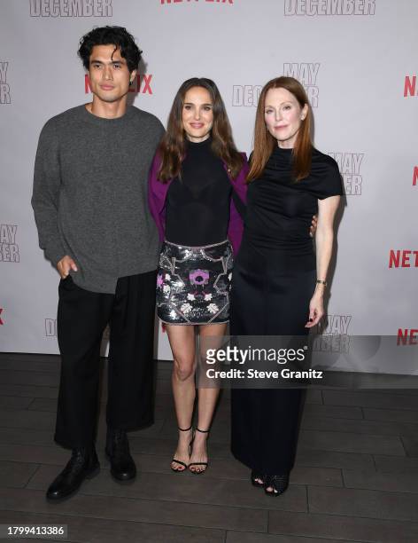 Natalie Portman, Charles Melton and Julianne Moore pose at the Netflix's "May December" Los Angeles Photo Call at Four Seasons Hotel Los Angeles at...