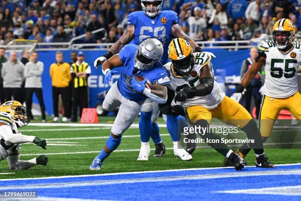 Detroit Lions running back David Montgomery finds a hole to run to the goal line and a two point conversion during the Detroit Lions versus the Green...