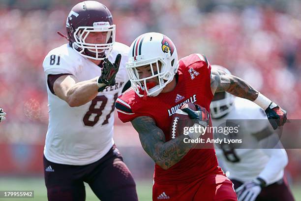 Damian Copeland of the Louisville Cardinals runs with the ball during the game against the Eastern Kentucky Colonels at Papa John's Cardinal Stadium...