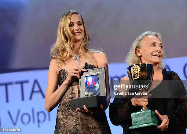 Actress Elena Cotta holds the Coppa Volpi award for best actress in 'Via Castellana Bandiera' before receiving a Jaeger-LeCoultre engraved Reverso...