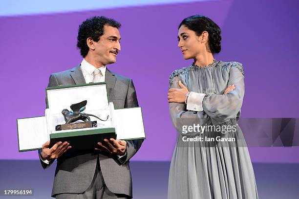 Orizzonti Jury member Iranian actress Golshifteh Farahani wears a Jaeger-LeCoultre Vintage Couvercle watch as she stands with Orizzonti Jury member...