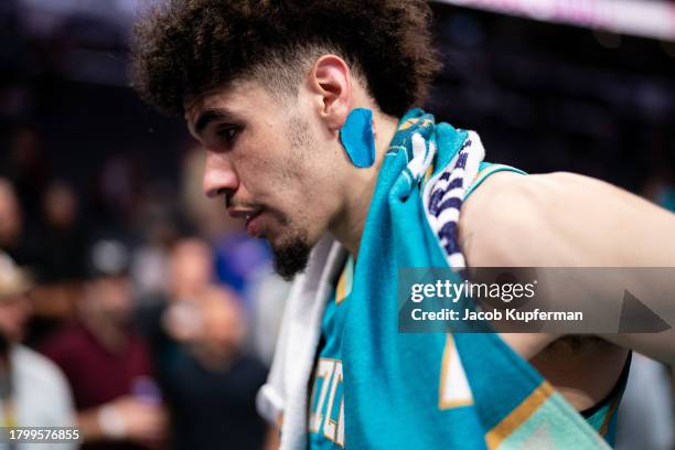 LaMelo Ball of the Charlotte Hornets looks on after losing to the Milwaukee Bucks during an NBA In-Season Tournament game at Spectrum Center on...