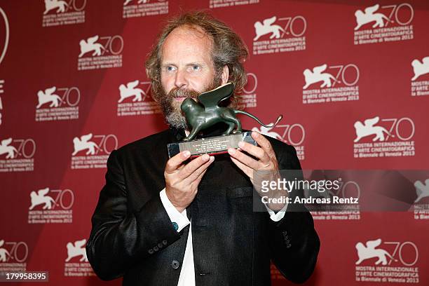 Director Philip Groning poses with the Special Jury Prize Award he received for his movie 'Die Frau Des Polizisten' as attends the Award Winners...