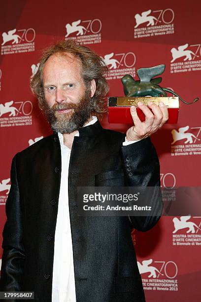 Director Philip Groning poses with the Special Jury Prize Award he received for his movie 'Die Frau Des Polizisten' as attends the Award Winners...