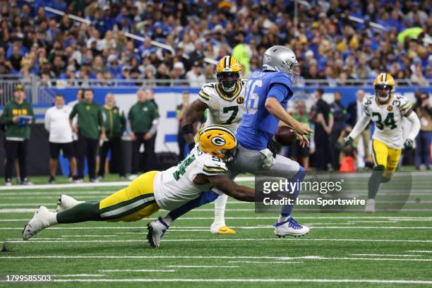 Detroit Lions quarterback Jared Goff tries to scramble away from Green Bay Packers defensive end Karl Brooks who knocked the ball loose during a...