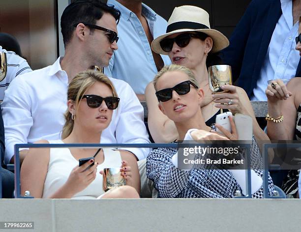 Model Kate Upton and Karolina Kurkova attend The Moet & Chandon Suite at USTA Billie Jean King National Tennis Center on September 7, 2013 in New...