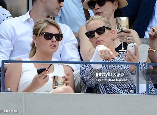 Model Kate Upton and Karolina Kurkova attend The Moet & Chandon Suite at USTA Billie Jean King National Tennis Center on September 7, 2013 in New...